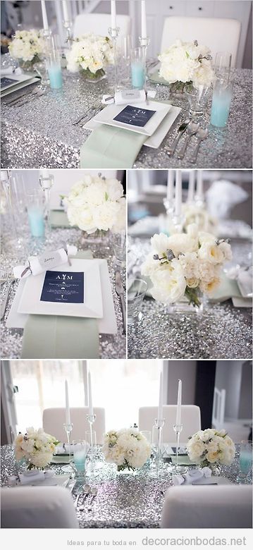 Mesa de boda con mantel plateado y flores blancas